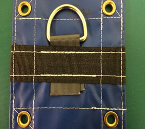 Tarp showing hook and grommets